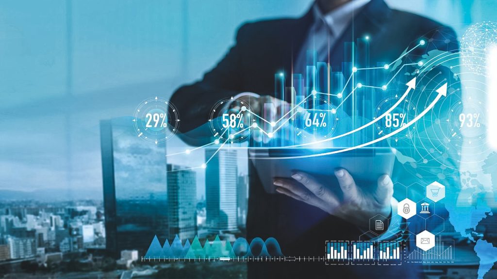 A person in a suit interacts with a tablet displaying abstract graphs and charts —analyzing real estate for business expansion to strategically diversify their portfolio.